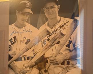 A truly special piece for any Boston Red Sox fan, this signed black-and-white photo captures two legends, Johnny Pesky and Dom DiMaggio. Both players are shown holding bats and have signed the photo with a clear, vintage-looking signature. This is a must-have for any collector of baseball memorabilia or a fan of the storied Red Sox franchise.