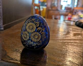 A beautiful and comprehensive collection of seven decorative glass eggs in the classic Fabergé style. Handcrafted in Russia, these eggs feature intricate etched designs in a variety of vibrant colors. They are perfect for a curio cabinet, as unique decorative pieces, or as a gift for a collector of classic Russian art.