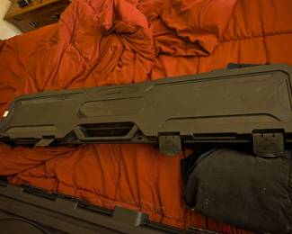This is a durable, hard-shell plastic gun case by Flambeau, designed to protect a rifle or shotgun. With its sturdy construction and convoluted foam interior, it's perfect for safely transporting a firearm to the range or for secure storage.