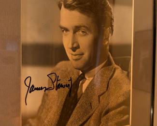 Framed photo with a signature that appears to be from James "Jimmy" Stewart, a beloved actor who starred in some of the most famous films of all time. His signature is highly sought after.