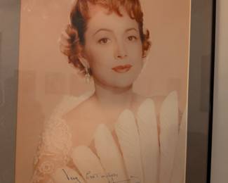 Framed color photo with a signature that appears to be from Silvana Mangano, a popular Italian film star.
