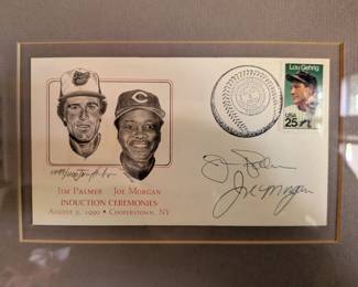 A rare and unique piece of baseball history! This framed First Day Cover commemorates the 1990 Hall of Fame induction of two legends, Jim Palmer and Joe Morgan. The cover is signed by both Hall of Famers and features an image of both players along with a stamp honoring Lou Gehrig. It's a great display piece for any collector of certified sports memorabilia.
