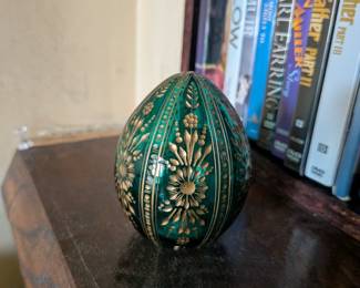 A beautiful and comprehensive collection of seven decorative glass eggs in the classic Fabergé style. Handcrafted in Russia, these eggs feature intricate etched designs in a variety of vibrant colors. They are perfect for a curio cabinet, as unique decorative pieces, or as a gift for a collector of classic Russian art.