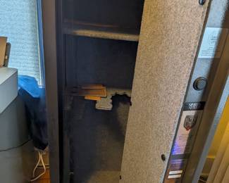 This is a fantastic opportunity to own a reliable and secure gun safe. This Sports Afield safe features a textured gray finish, a programmable electronic lock, and a sturdy build, providing peace of mind for your firearms, documents, and other valuables. Its interior is fully adjustable, making it a versatile storage solution for any home.