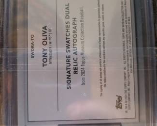 A fantastic piece of Minnesota Twins history! This is a genuine collectible card featuring a hand-signed autograph from Hall of Famer Tony Oliva, along with a piece of a game-used bat. The autograph and memorabilia are authenticated and guaranteed by Upper Deck. This limited edition card is a must-have for any Twins fan or serious collector.