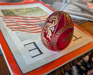 A beautiful and comprehensive collection of seven decorative glass eggs in the classic Fabergé style. Handcrafted in Russia, these eggs feature intricate etched designs in a variety of vibrant colors. They are perfect for a curio cabinet, as unique decorative pieces, or as a gift for a collector of classic Russian art.