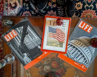Step back in time with this collection of three vintage magazines, including two issues of LIFE from 1937 and a TIME magazine from 1942. Each magazine is a fascinating look into the past, offering a glimpse into the news, culture, and advertisements of the era. The TIME magazine features a striking cover with the American flag during World War II. These are perfect for a history buff, a collector of vintage periodicals, or as unique decorative pieces.