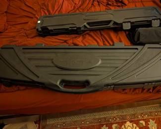 This is a heavy-duty, hard-shell gun case, likely capable of holding two rifles or shotguns. With its rugged construction and thick, protective foam interior, this case is an essential accessory for any firearm owner. It offers excellent protection for transportation to the range, a hunting trip, or for secure storage.