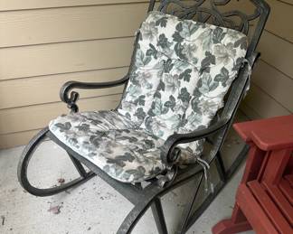 Metal rocking Chair with greenand white ivy cushions
