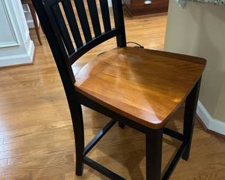 Pair of black counter stools with brown seat, 23.5" x 38"
