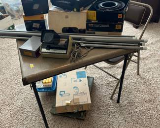 Vintage projector, screen and slide equipment, Kodak equipment, vintage Samsonite folding table and folding chair