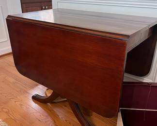 Mahogany drop-leaf table, 29.5 high, 22.5 deep, 42 wide. leaves measure 17.5 x 2 = total length with center 56 length