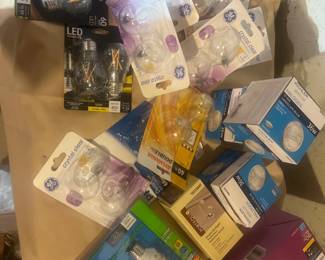 Mixed lot of light bulbs including LED, halogen, and incandescent styles