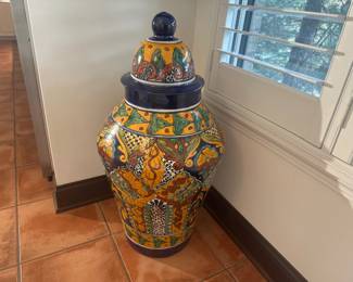 Vibrant Talavera-style ceramic jar with lid, in classic multicolor floral and geometric design.