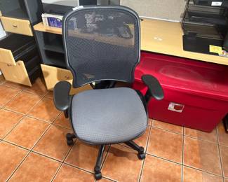 Comfortable mesh office chair with contoured back, cushioned seat, and adjustable armrests
