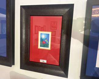 Whimsical folk art print of a hummingbird and flower, framed with bold red mat.