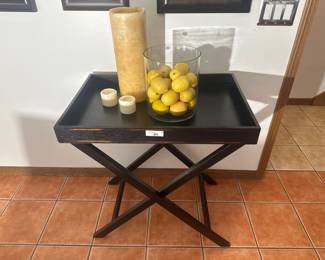Portable black tray table with removable top and folding X-shaped base