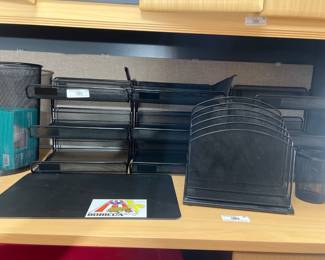 Set of black metal mesh desk organizers.