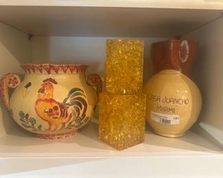 Assorted decorative pottery vases, including rooster motif and Casa Juancho Miami jug.