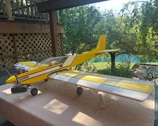 RC Goldberg Tiger 40 model in yellow/white scheme with pilot figure and Saito FA-80 engine.