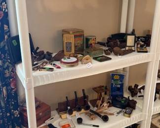 Nice collection of pipes, pipe holders, and humidor and tobacco products 