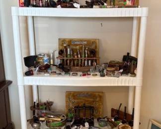 Nice collection of pipes, pipe holders, and humidor and tobacco products 