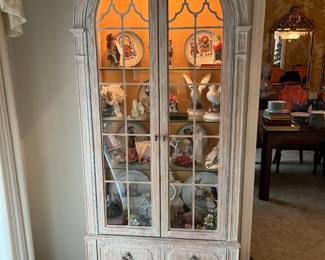 This unusual Curio Cabinet is simply gorgeous! Beautiful muted coral colors on solid wood, it is so pretty! Has top light to showcase your collections beautifully!