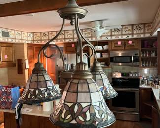 This Tiffany style light fixture is also available! Very nice and in good condition...bring someone to remove safely and we will plate the hole!