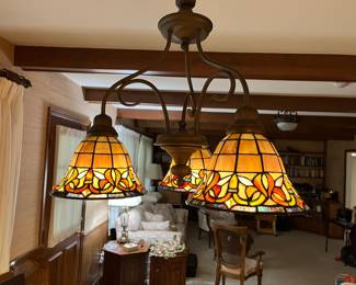 This lovely Tiffany style light fixture is for sale...very good condition. Bring someone to take it down safely and we will plate the hole