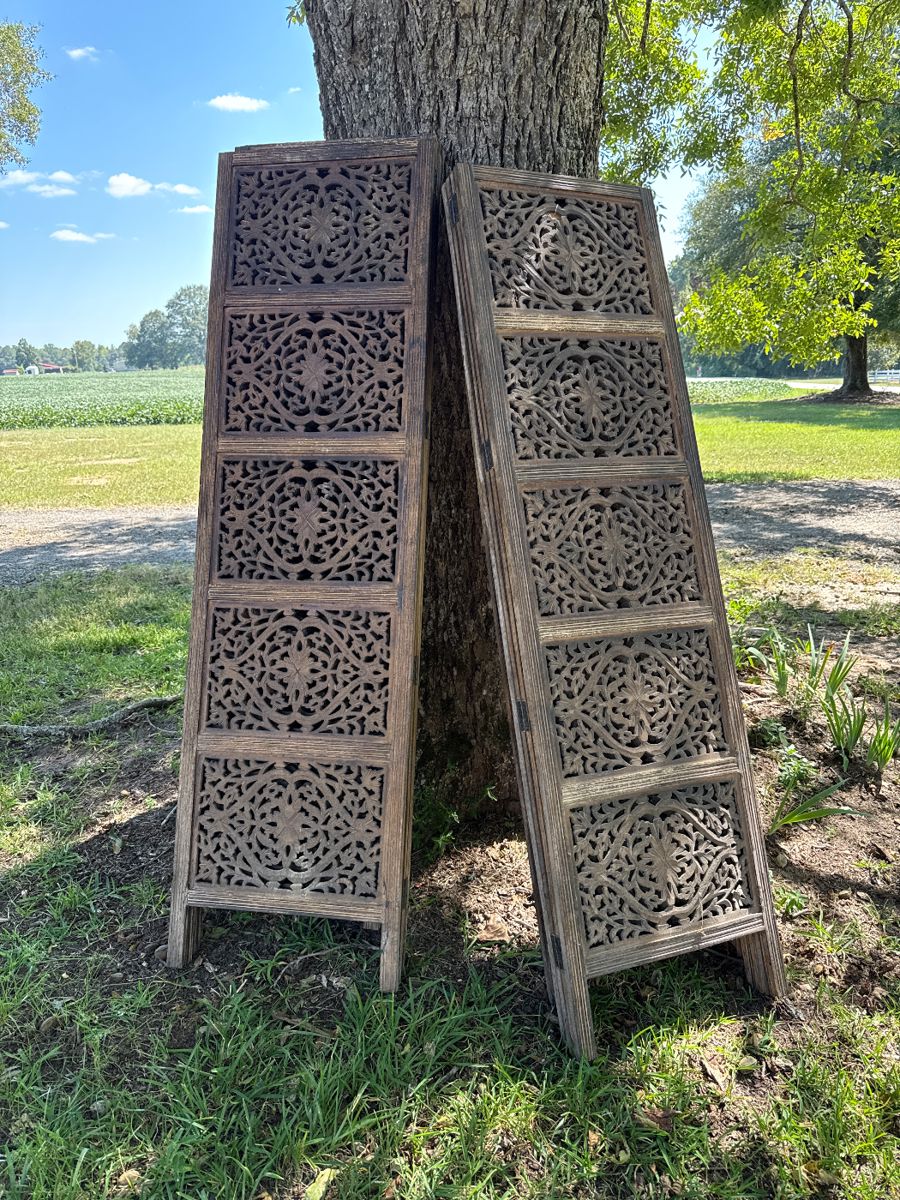 3 wood screens. Each screen has 4 panels