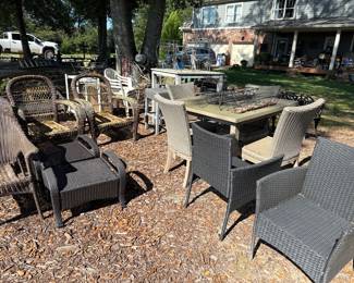 Outdoor wrought iron and plastic wicker furniture and plant stands