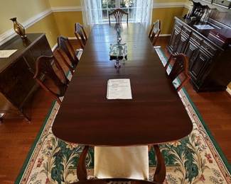 antique dining table with 4 leaves, extend to 9'; includes 2 armchairs and 5 chairs