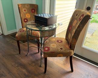 Charming round glass table & cozy chairs. Game set perfect for tabletop