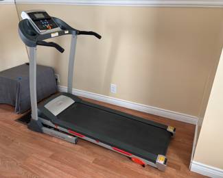 “Skinny” brand treadmill, with minimalist, easy to move design.