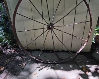 Numerous carriage & wagon wheels throughout garden. 