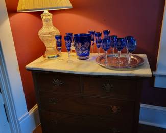 Cobalt stemware on silver plate tray, . Single crystal lamp.