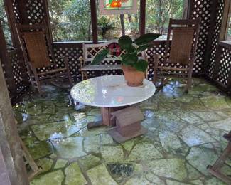 Coca-Cola bench, 4 Rocking Arm chairs, 40" diameter "married" marble table. Butterfly stained glass sun screen.