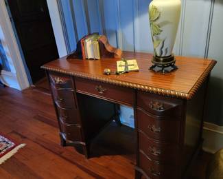 Mahogany writing desk circa 1940's with gadroon edge.