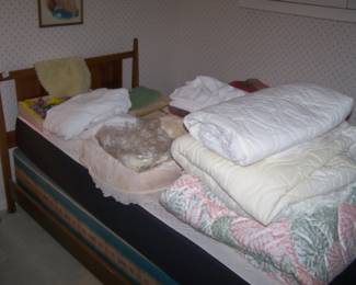 ONE OF THE TWIN BEDS & BEDDING