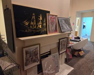 Some of the artwork we have available and a great plant rack in the corner, too!