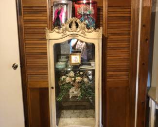 Glass curio cabinet and Christmas Barbies