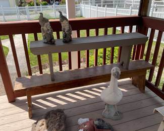Concrete goose, older wood benches