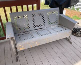 Very nice metal glider. It is in the backyard.