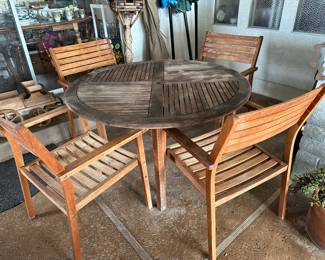 Teak round table with four chairs that breakdown to move