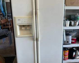 Large garage refrigerator with ice and water on the door plugged in so you can check out it’s nice and cold