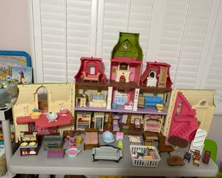 Super fun open up dollhouse shown from the backside with Selections of furniture, you could add in front