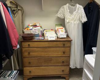 Four Drawer chest of drawers,  ladies jackets,  nightgown two pce set, Storage containers,  storage rack, greeting cards, and card making supplies 