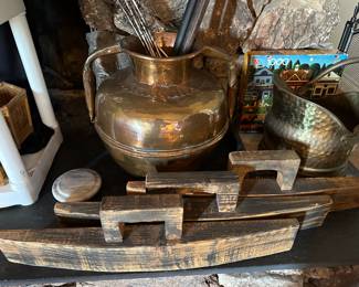 Brass pot with peacock feathers, coal bucket, wood decor