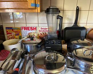 Vitamix blender with all accessories, instructions, and recipe books