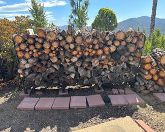 Cut, dried firewood well over a cord and iron rack also available 
you know what this costs at the grocery store!